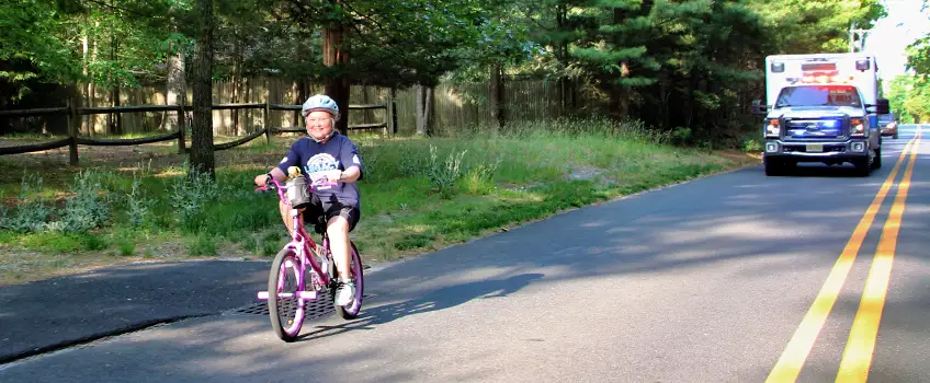 A young child safety participating in the legacy ride.