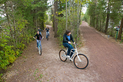 students riding bikes down a path