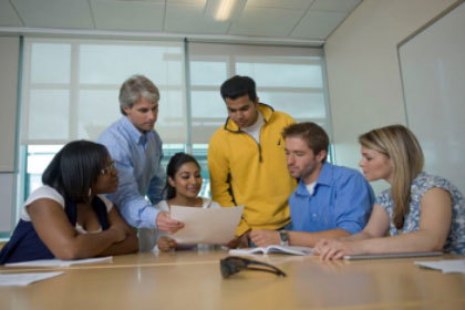 students learning at a table