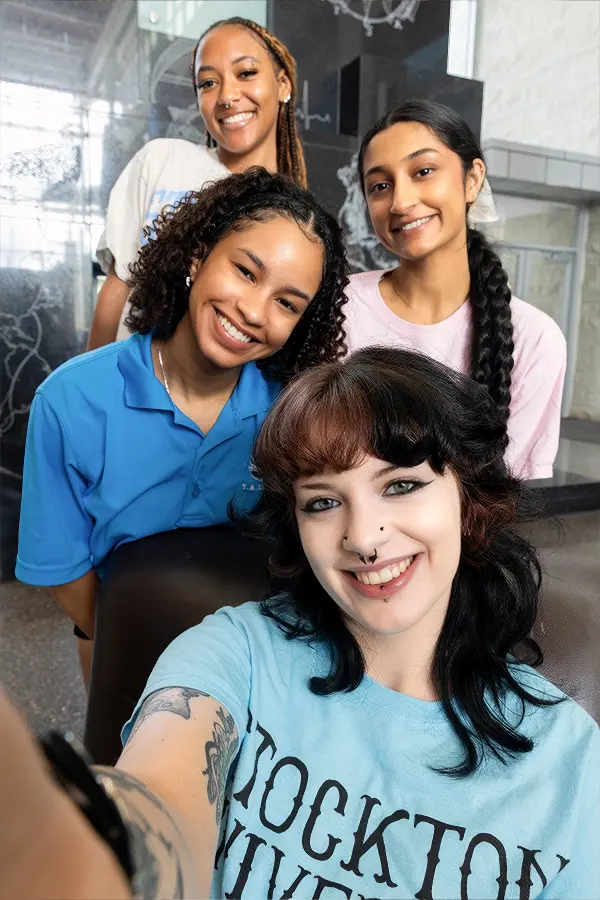 Andrea Jones taking a selfie with friends