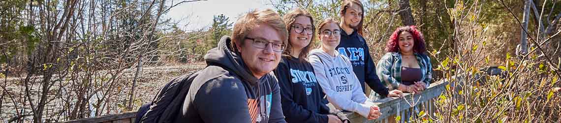 Students pose on the path around Lake Fred