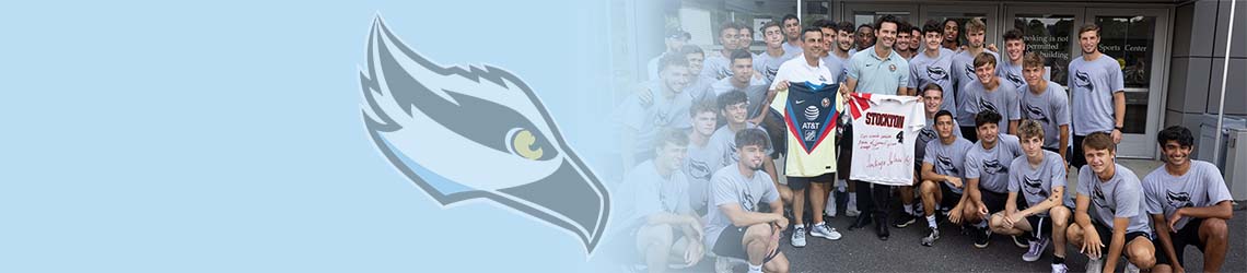 Men's soccer team posing with Santiago Solari outside the Sports Center