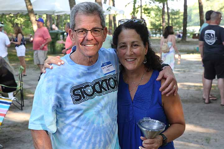 A male and female alum smile during Spring Bash