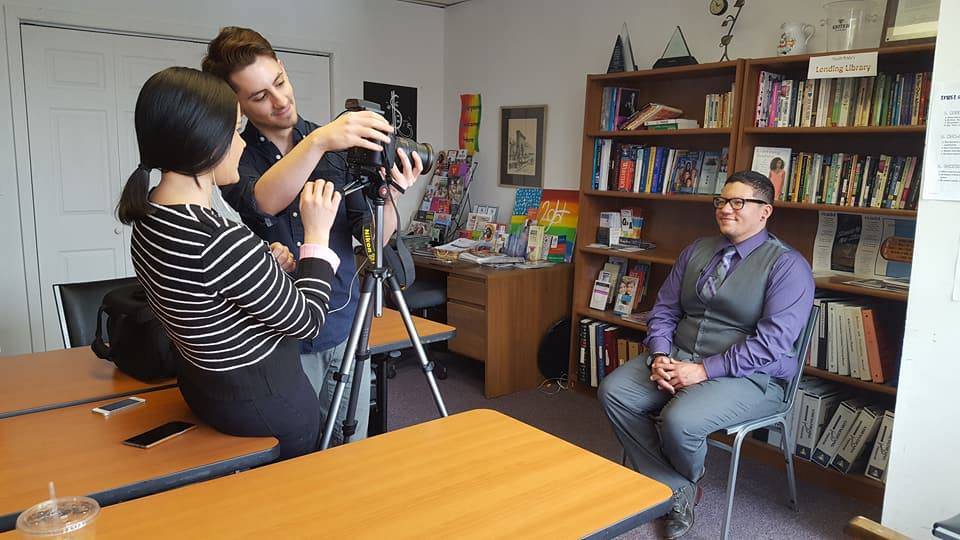 Eric Anglero being filmed by students