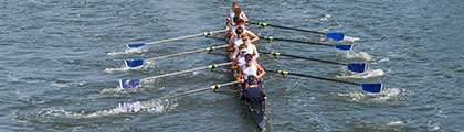 students rowing a boat