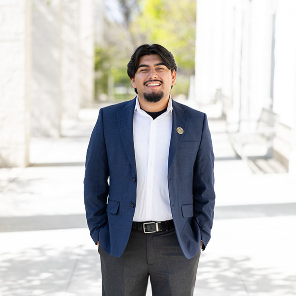 Alexander Mendoza '26 stands along the walkway in front of the Campus Center.