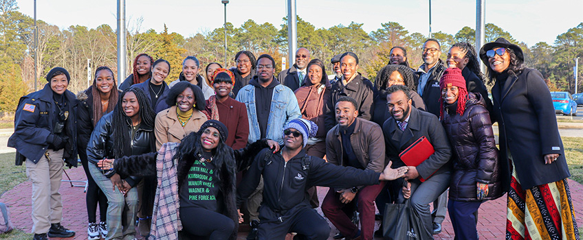 Black faculty, staff and students at Stockton during BHM flag raising