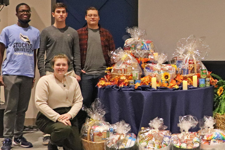 Student volunteers with donated food baskets