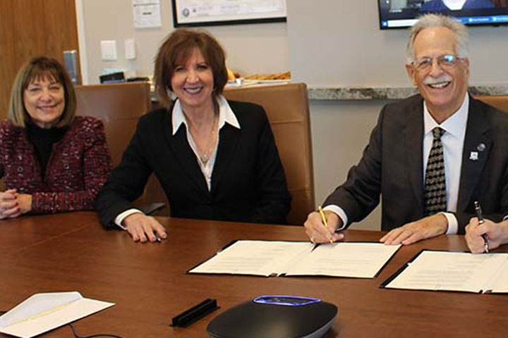 Barbara Perskie, Stockton Foundation Chair Donna Buzby, Steven P. Perskie and Stockton President Harvey Kesselman at signing for Perskie Family Endowed Scholarships in 2021