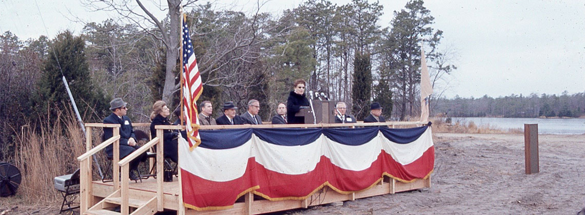 Elizabeth Alton, along with other trustees and guests, speaks at the opening of Stockton