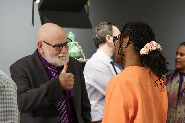 Service-Learning faculty speaking with a student