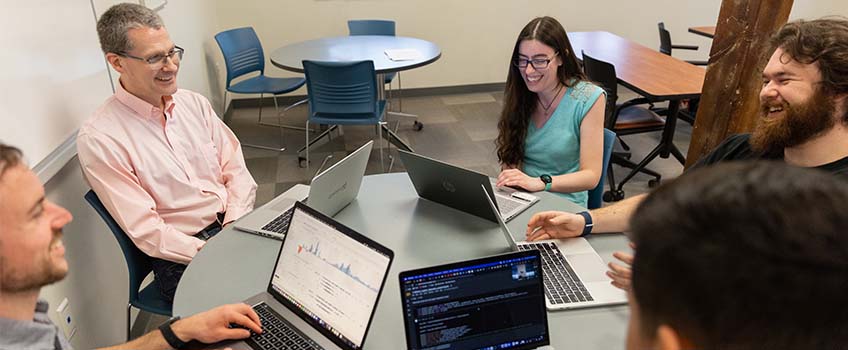 Students and faculty with laptops