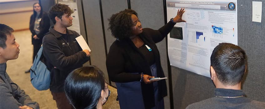 student presenting at the Graduate Research Symposium