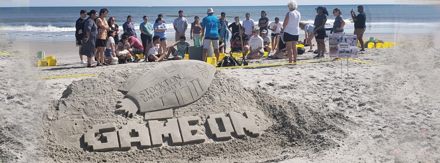 Student training themed game on sand art on the AC Beach Student training themed game on sand art on the AC Beach