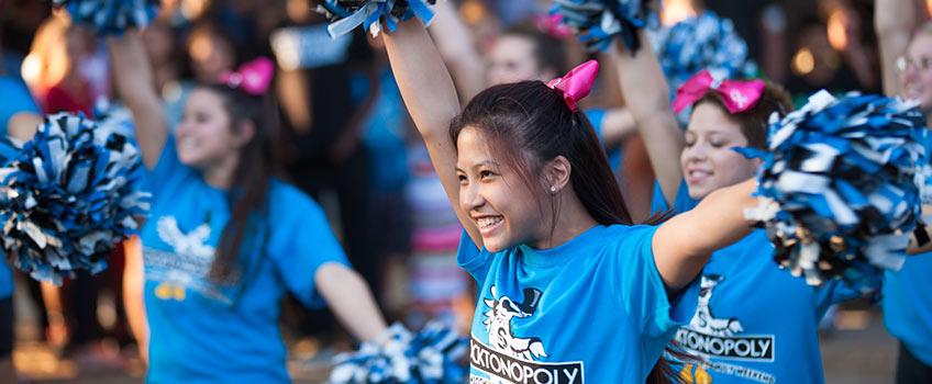 Stockton cheerleaders are performing at a campus event. Stockton cheerleaders are performing at a campus event.