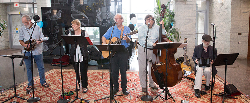Staff faculty band playing in front of the fireplace Staff faculty band playing in front of the fireplace