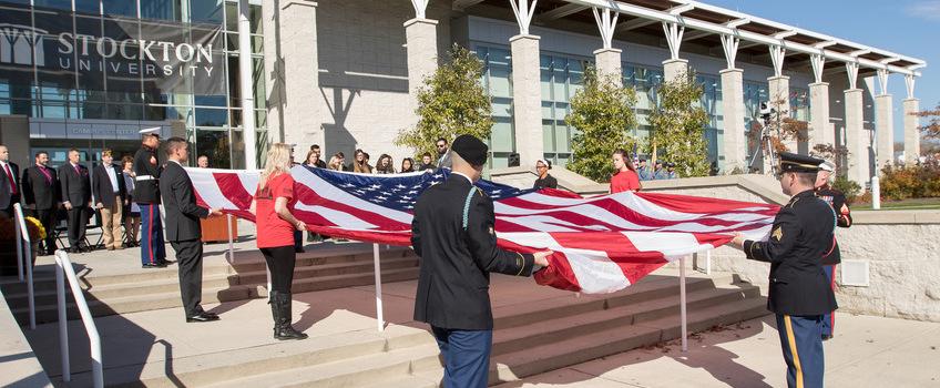 Veterans day holding the American flag Veterans day holding the American flag