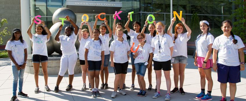 Kids gathered for a group photo holding up letters that spell out STOCKTON Kids gathered for a group photo holding up letters that spell out STOCKTON