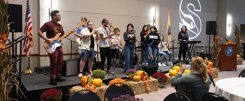 Staff faculty band playing at a dinner in Fall Staff faculty band playing at a dinner in Fall