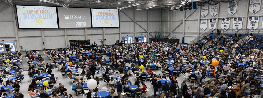 A full house of attendees in the sports center for an Admissions program A full house of attendees in the sports center for an Admissions program