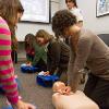 Chelsea Snyder teaching Hands-Only CPR during the NCEMSF CPR Day 