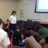 Barry Kraus, Sgt. Kelly Warantz, Chelsea Snyder  teaching Hands-Only CPR during the NCEMSF CPR Day