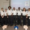 Joe Lizza, Zoe Stein, Sgt. Kelly Warantz, Abe Isak, Lt. Keval Patel, Caleb Bayewu, , Chelsea Snyder, Nick Amos teaching Hands-Only CPR during the NCEMSF CPR Day