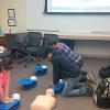 Zoe Stein teaching Hands-Only CPR during the NCEMSF CPR Day