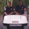 Sgt. Ross Clouser, Joe Lizza in golf cart during Welcome Week