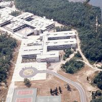 Aerial view of the campus in 1974—the tennis courts are gone, and the circle relocated. Its location in this building would be partially beneath today’s Arts and Science building.
