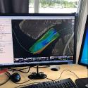 The computer screen displays DiBlasi's work in capturing bathymetric data. "The colors are indicative of water depth which helps in understanding the dynamic tidal and river currents, sediment deposition and potential marine habitat along the Mullica. We can use this data to understand how these currents could be affecting the shipwrecks," said Nagiewicz. 