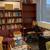 Professor Deborah Gussman packing Ashton's books from the Writing Lounge before being sent to the Women's, Gender, and Sexuality Center