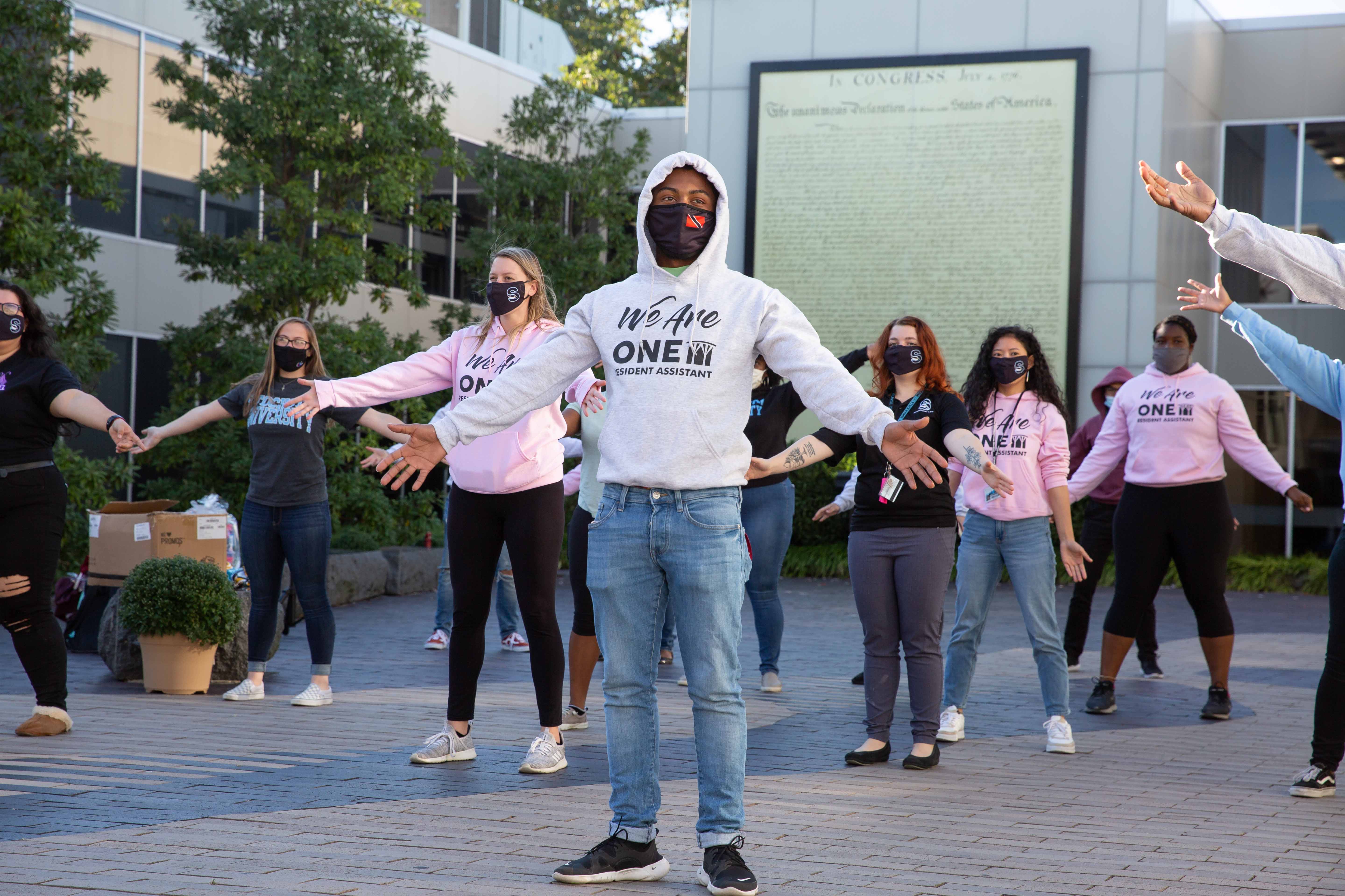 Students reminded each other that "we are one" with a flash mob.  Students reminded each other that "we are one" with a flash mob.