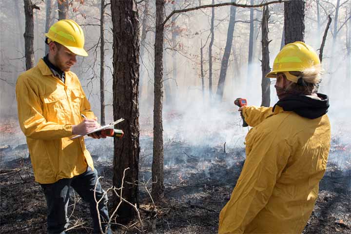 New Jersey Forest Fire Service crew members show Stockton students how to conduct a controlled burn. New Jersey Forest Fire Service crew members show Stockton students how to conduct a controlled burn.