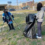 student cleaning up a park in Atlantic City