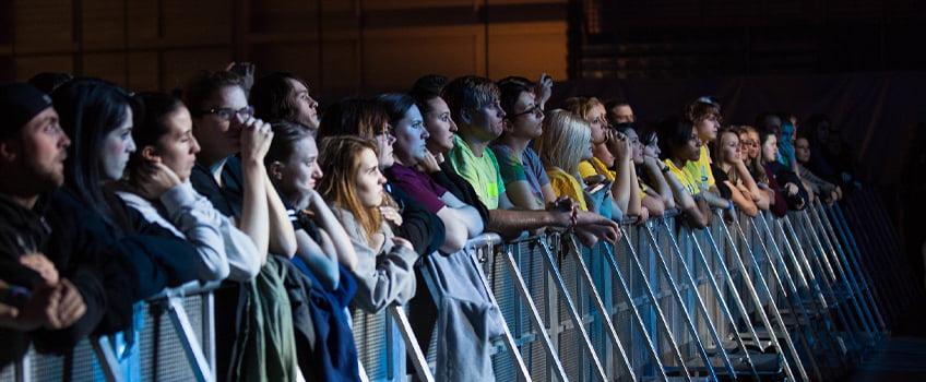 Students behind a gate at a Woodstockton concert Students behind a gate at a Woodstockton concert