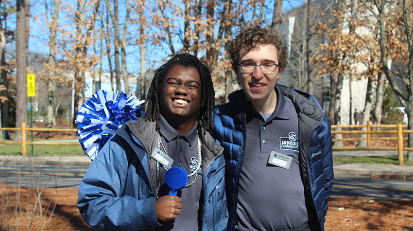 Two Admissions Ambassadors smiling for the camera. Two Admissions Ambassadors smiling for the camera.