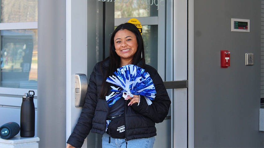 An Admissions Ambassador waiting at the door to Big Blue. An Admissions Ambassador waiting at the door to Big Blue.