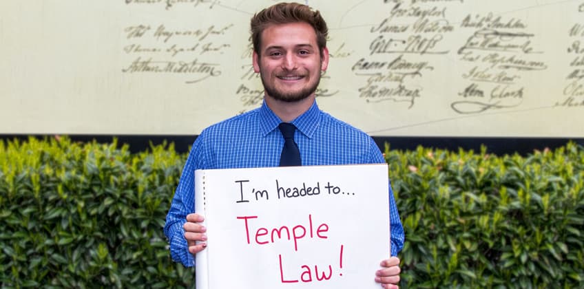 Maxwell Klenk holding sign, "I'm headed to Temple Law" Maxwell Klenk holding sign, "I'm headed to Temple Law"