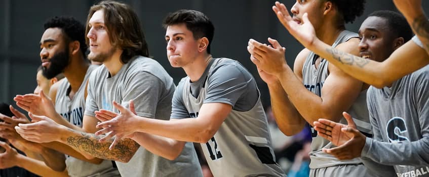 Stockton athletes cheering to support their team. Stockton athletes cheering to support their team.