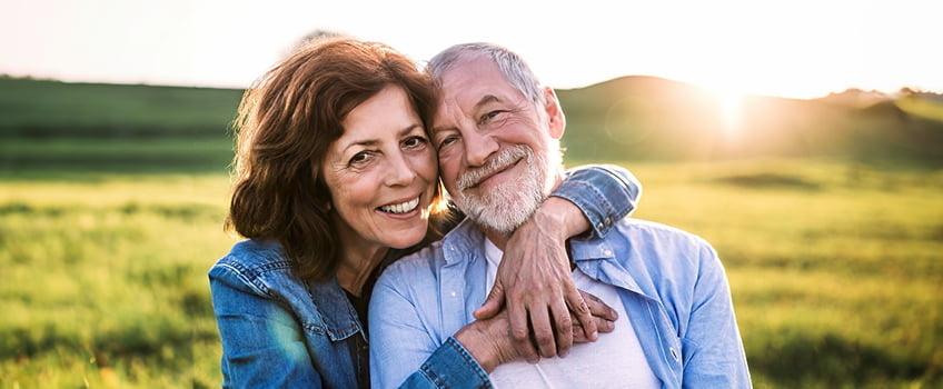 A older woman and man smiling for the camera A older woman and man smiling for the camera