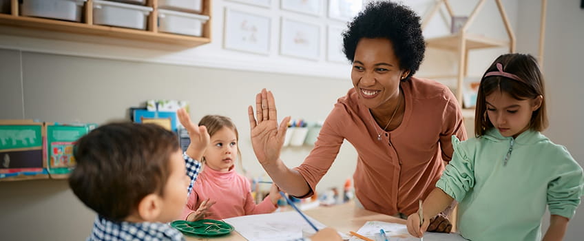 Students and teacher in a classroom Students and teacher in a classroom