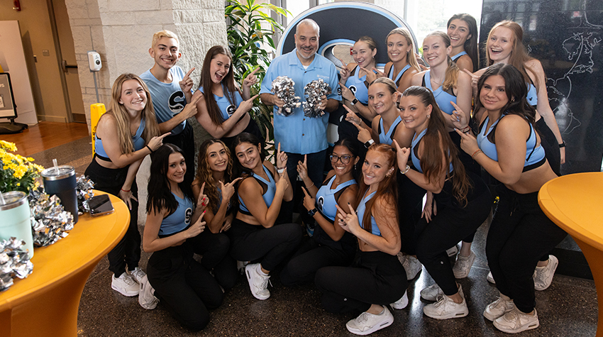 Stockton Cheerleaders and President Joe posing for a photo. Photos by Susan Allen.  Stockton Cheerleaders and President Joe posing for a photo. Photos by Susan Allen.