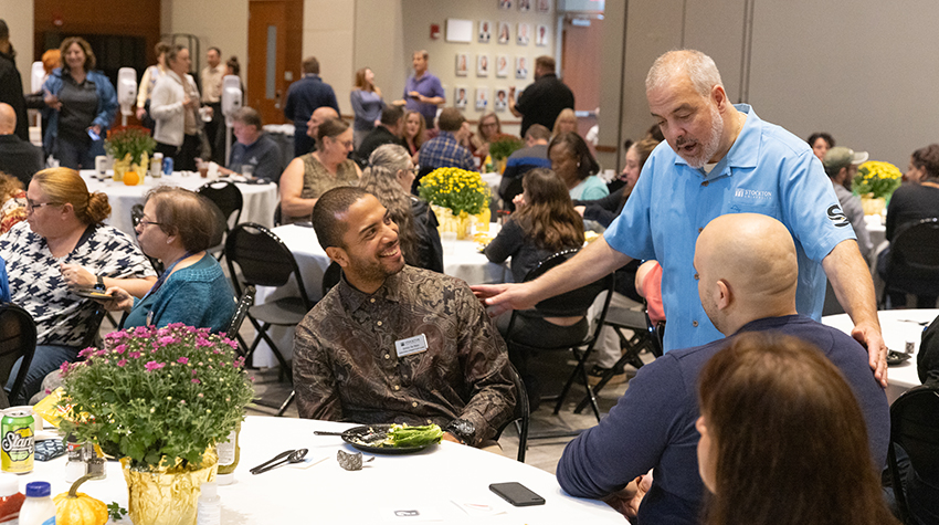 President Joe talking with staff members during the Autumn Jam. Photos by Susan Allen.  President Joe talking with staff members during the Autumn Jam. Photos by Susan Allen.