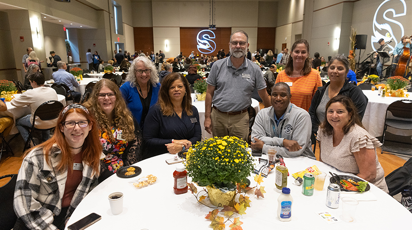 Staff members posing for a photo at the Autumn Jam. Photos by Susan Allen.  Staff members posing for a photo at the Autumn Jam. Photos by Susan Allen.