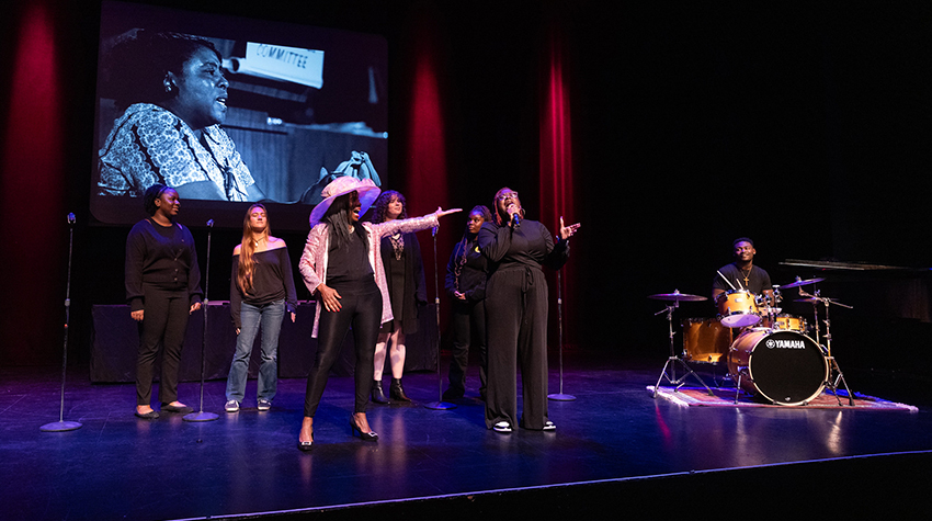 Student Lillian Nickels singing her solo during the symposium Student Lillian Nickels singing her solo during the symposium