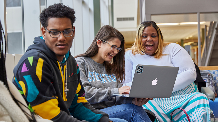 Students talking amongst themselves in the hallway of F-wing Students talking amongst themselves in the hallway of F-wing