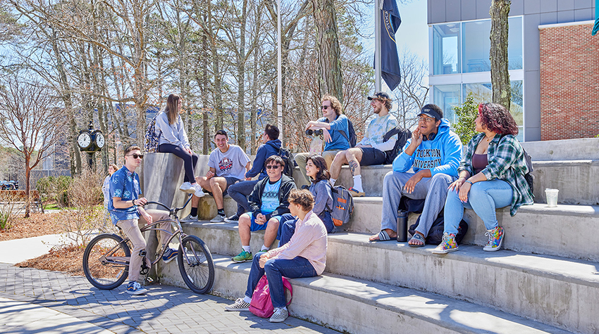 Students talking, laughing outside K-wing Students talking, laughing outside K-wing
