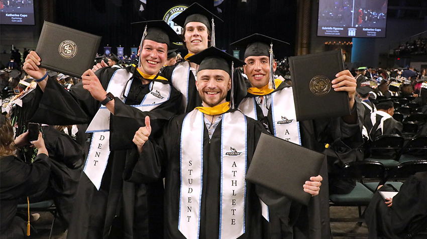 Student-athletes with their diploma (covers) Student-athletes with their diploma (covers)
