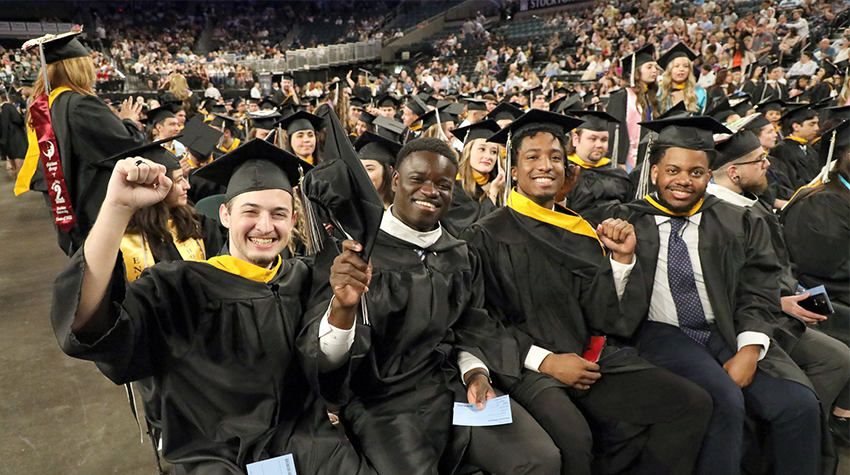 Students cheering during the ceremony Students cheering during the ceremony